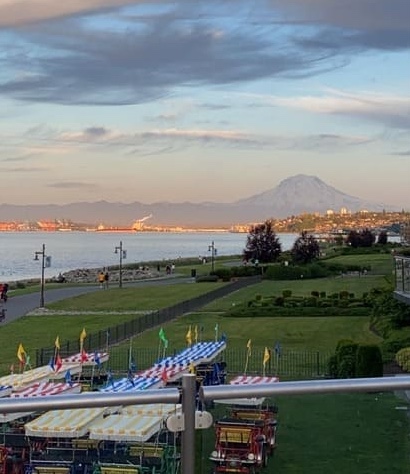 The sun rising with Mount Rainier in the background
